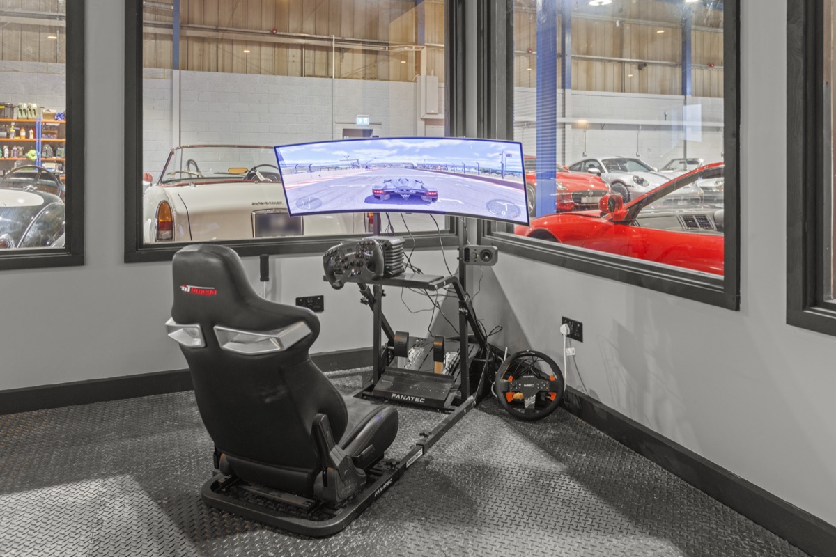 Racing simulator in client entertainment area