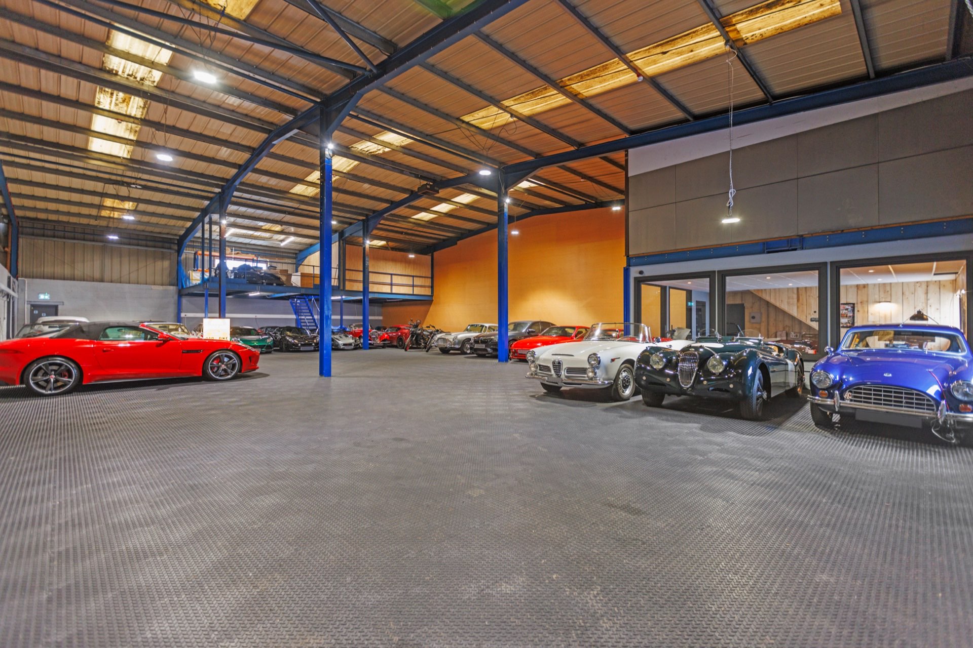 Secure Car Storage facility interior with luxury and classic vehicles