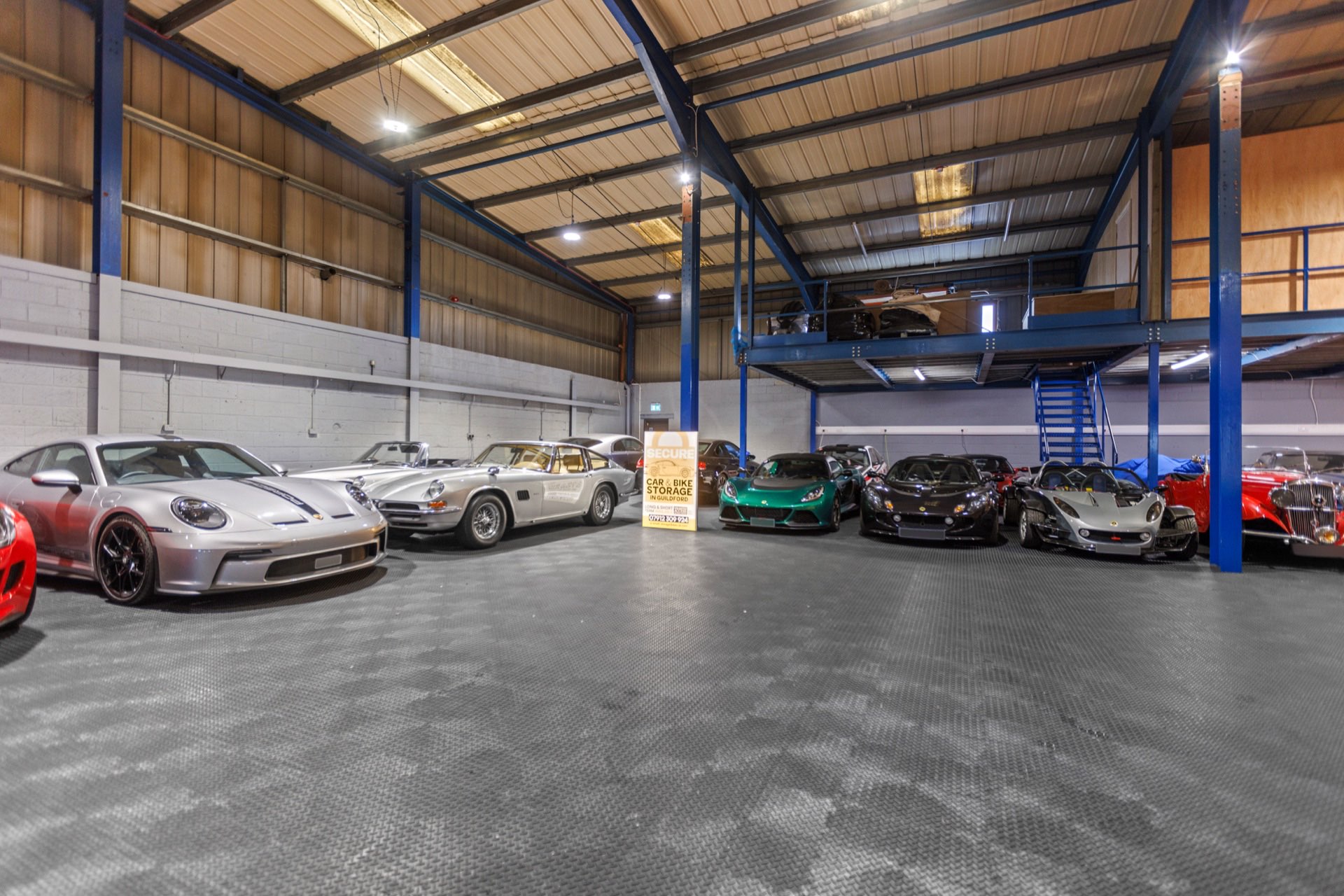 Supercars and classics lined up in the secure storage hall