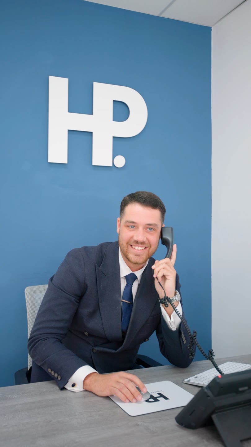 Ben, sales manager at H Prestige Estates, on the phone at the South Ascot office