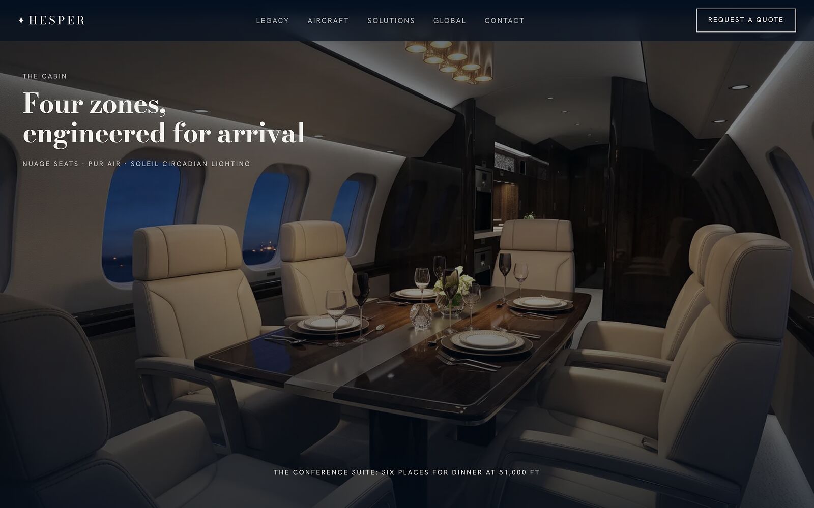 The conference suite of a private jet cabin, set for dinner, on the Hesper Jets website